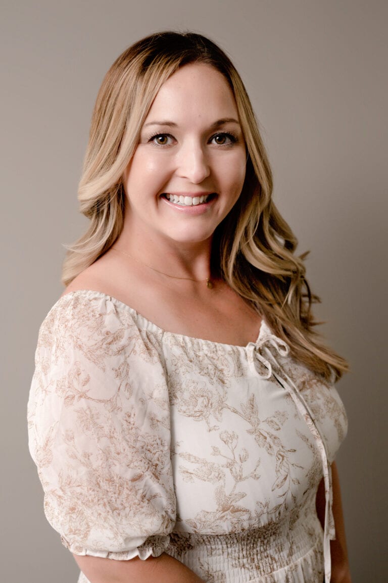 Business portrait of a woman with blonde hair.