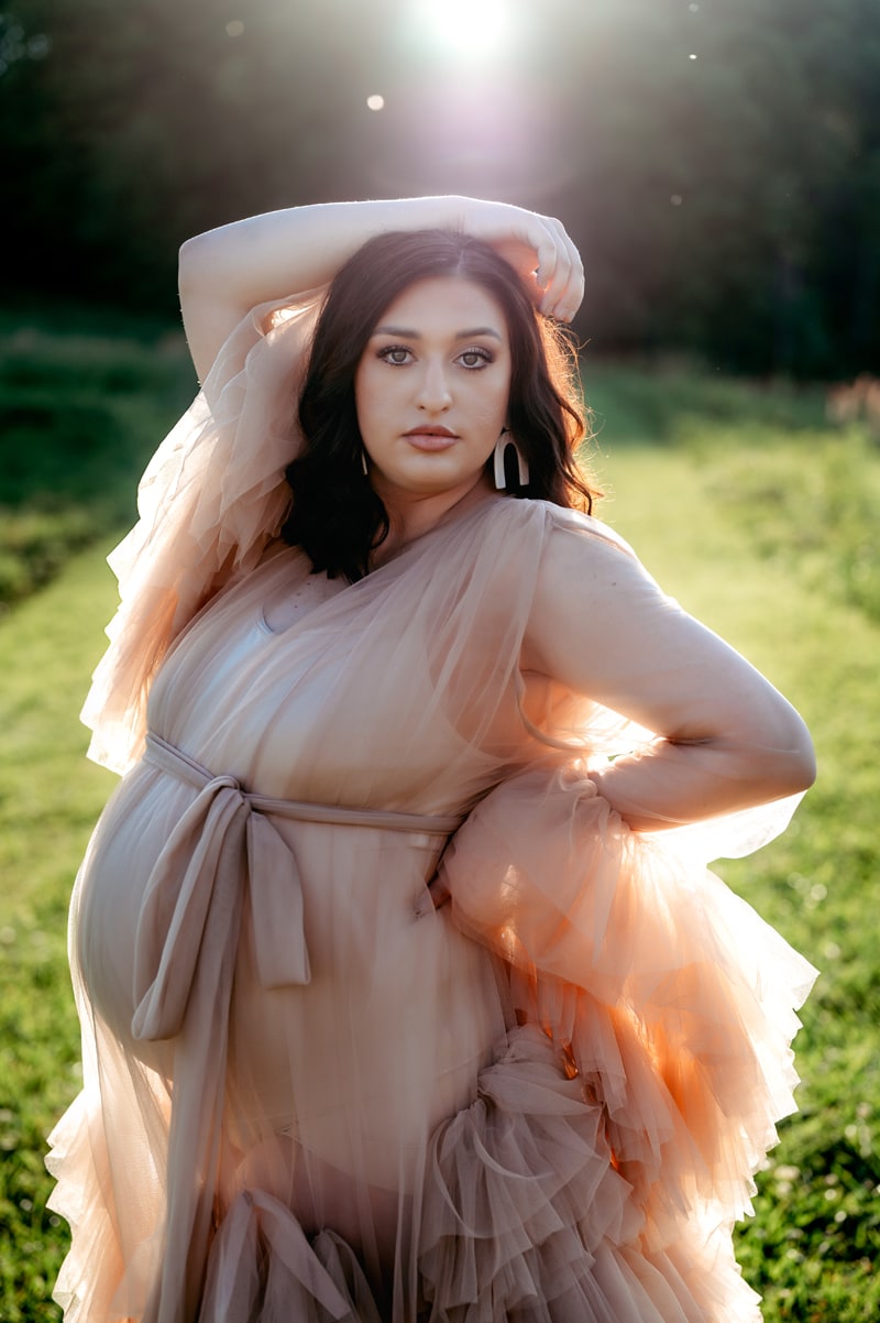 Outdoor maternity session. Mom is wearing a nude color robe and has the best model look.