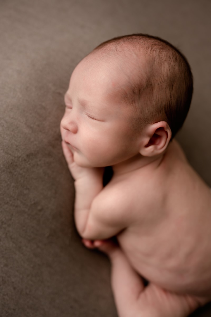 Newborn baby boy face close-up.