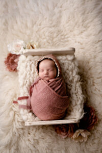 Newborn baby girl in pink. WV newborn photographer.
