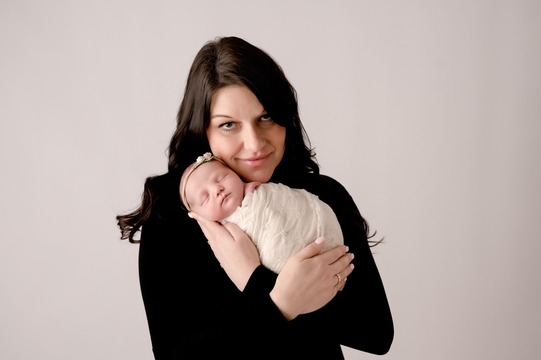 Mom holding newborn girl