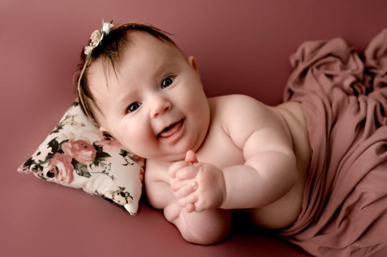 3 month old photoshoot of girl on pink