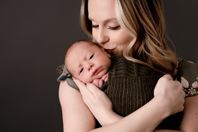 Mom holding her newborn baby boy. Pittsburgh newborn photographer