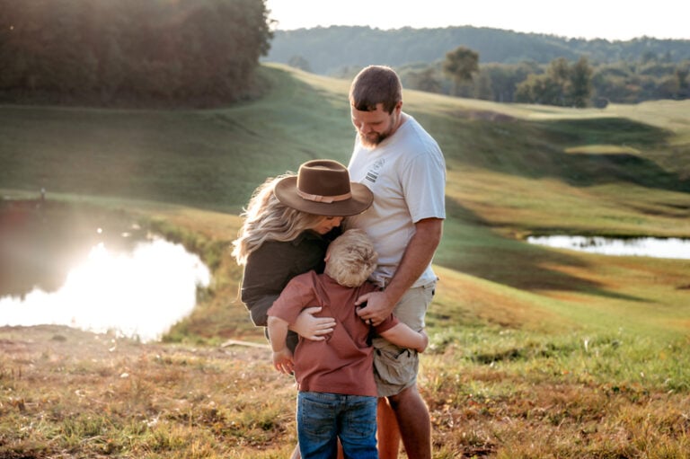 Family of 3 loving on each other at Paradise Lake Golf Course off Grafton Road in Morgantown, WV